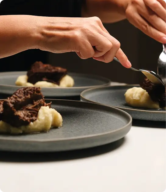 Chef plating gourmet dish