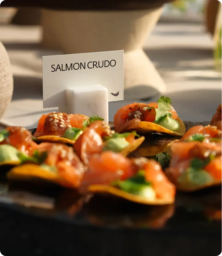 Salmon crudo appetizer with fresh ingredients on display